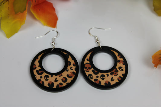 Leopard pattern dropped hoop earrings, fashion statement styled jewelry layered wood and acrylic plastic. pattern has skull detail within